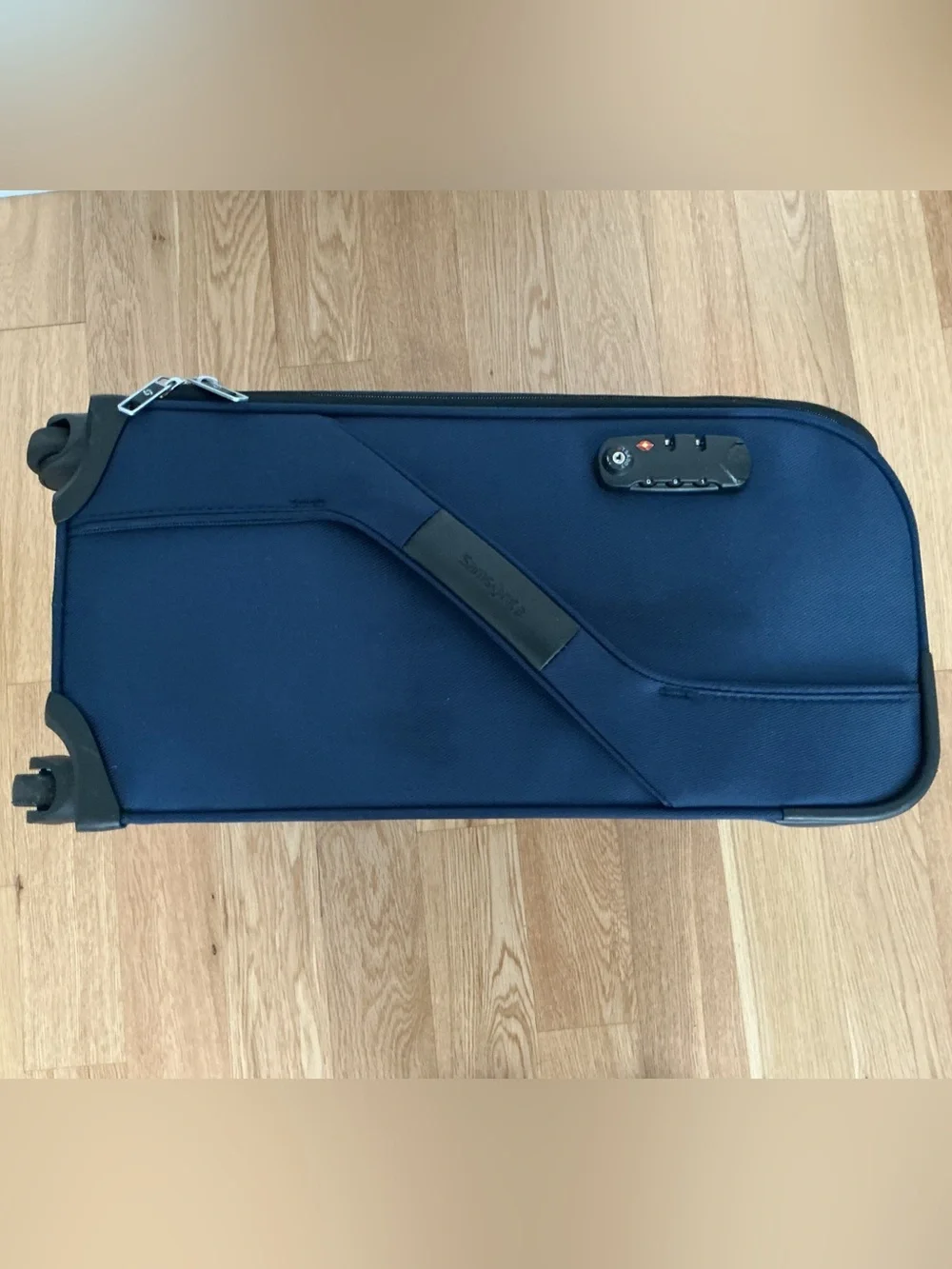 Samsonite Optimum softside spinner carry-on suitcase.